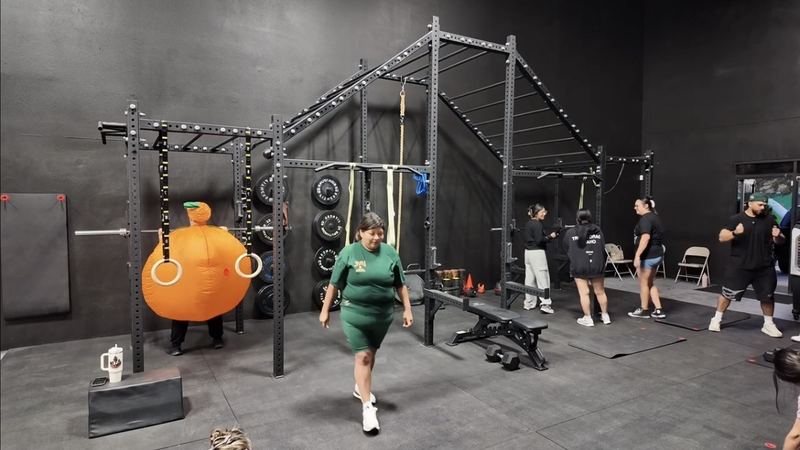 A group class at the ATG rig — one member in a pumpkin costume